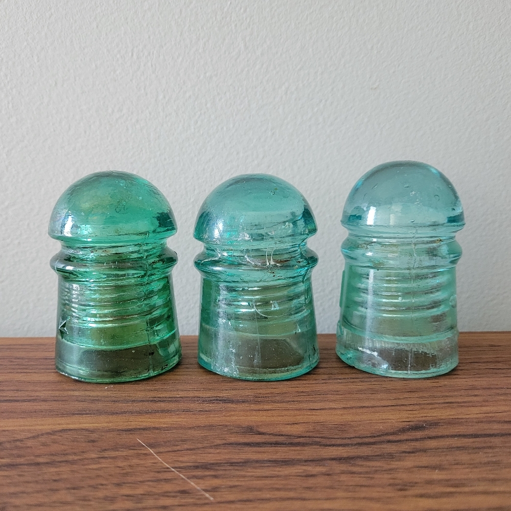 ANTIQUE set of 3 glass insulators in a green blue colour
